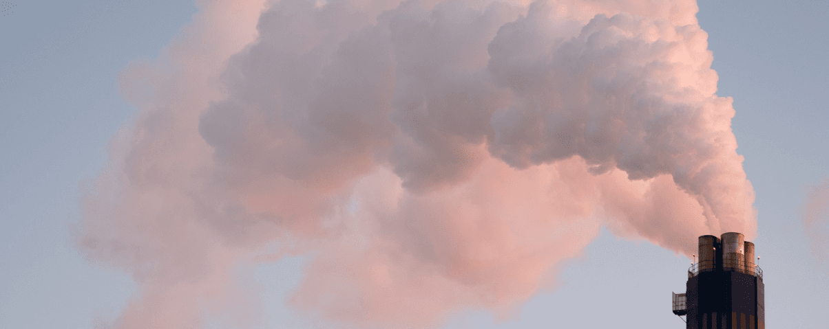 Industrial smokestack emitting formaldehyde and VOC-laden exhaust into the atmosphere