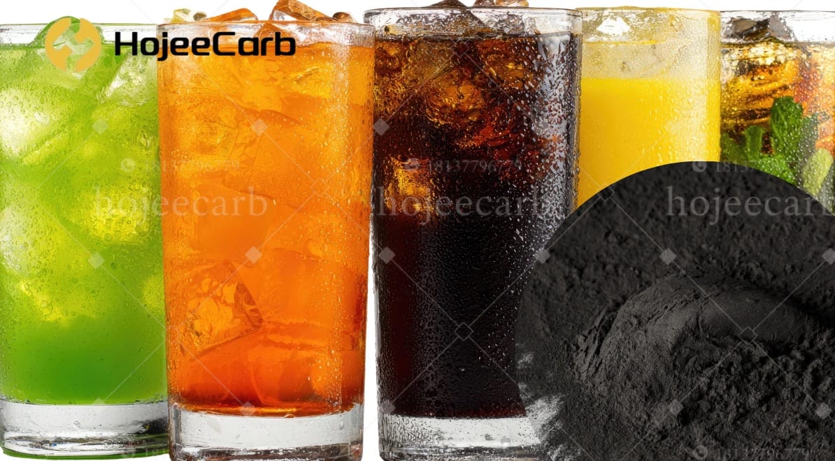 A lineup of colored soft drinks over ice beside a mound of fine black powdered activated carbon \u2014 food-grade decolorizing and deodorizing agent for beverage processing