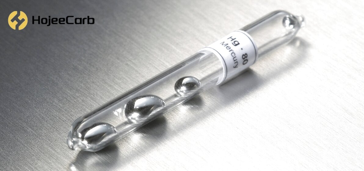 Sealed glass ampoule of liquid mercury (Hg, atomic number 80) on a brushed steel surface — the emission target for activated carbon mercury sorbents
