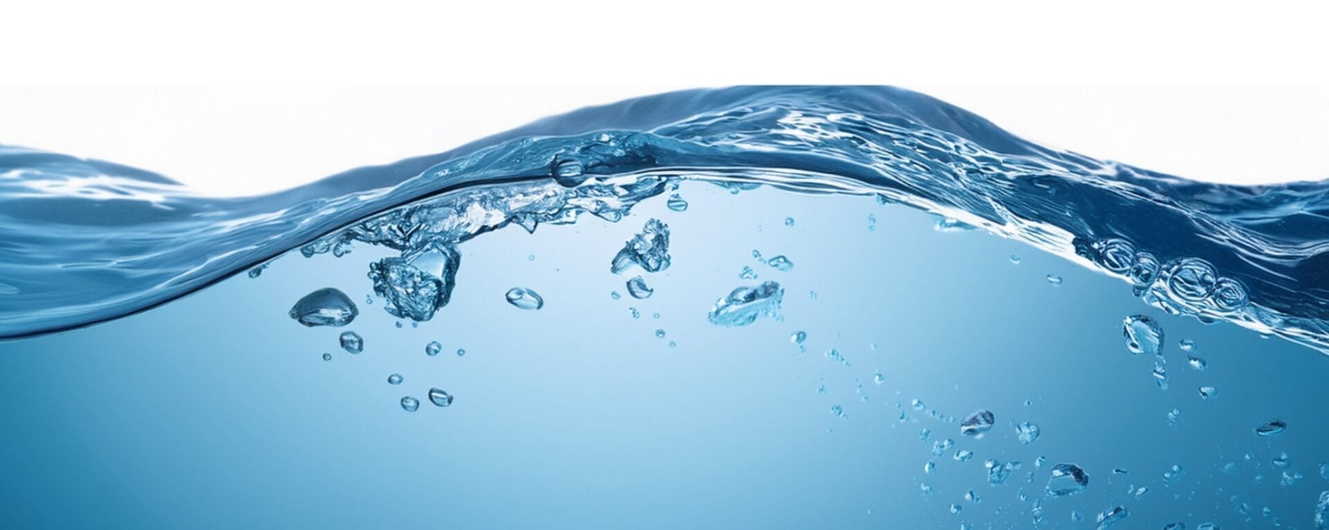 Clean water surface with splash and bubbles — activated carbon for PFAS removal in drinking water