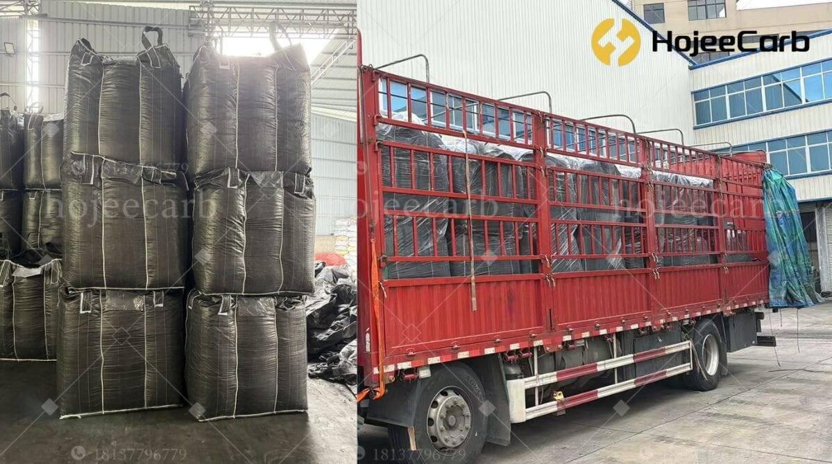 Black FIBC jumbo bags of activated carbon stacked inside a warehouse on the left, and loaded onto a red stake-bed truck parked beside the factory on the right — HojeeCarb bulk export shipment
