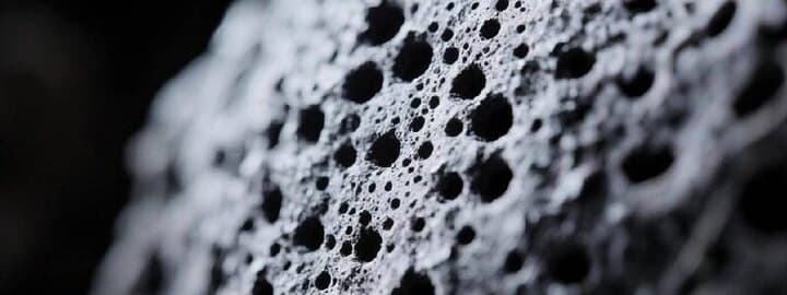 Close-up of activated carbon showing its highly porous surface structure