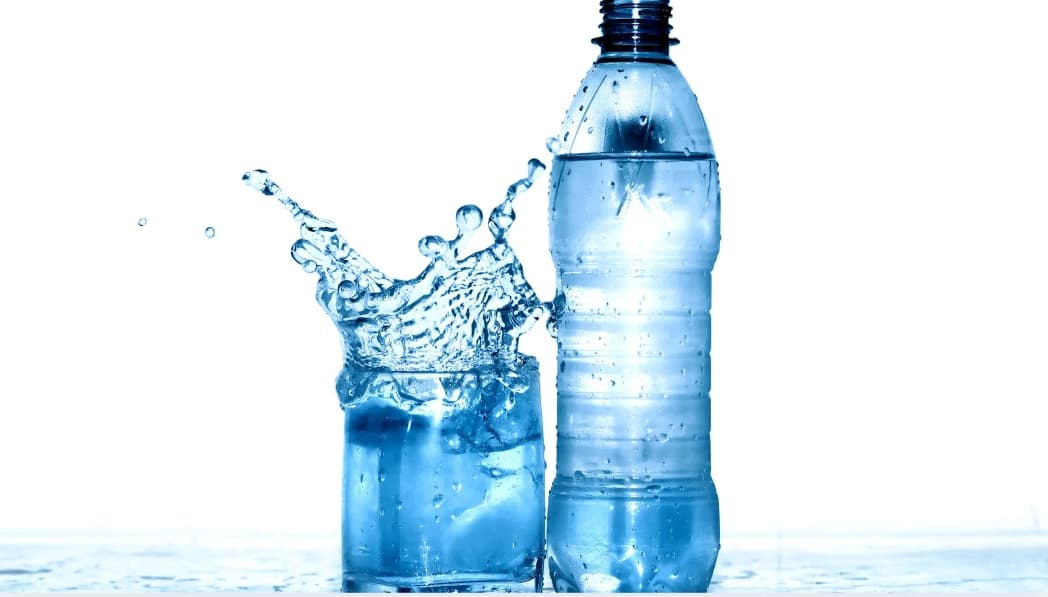 Pure bottled water splash — activated carbon purification for bottled water production