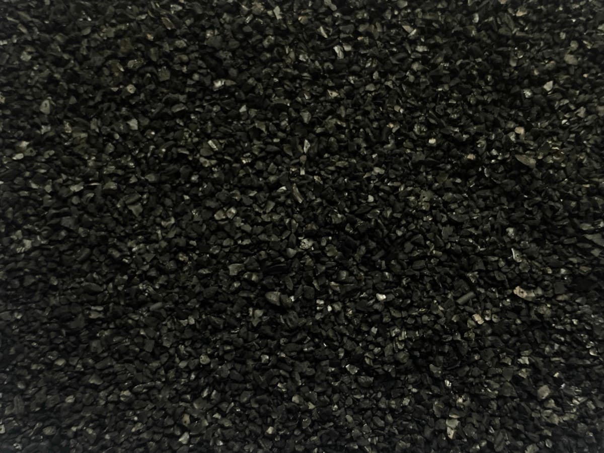 Granular activated carbon filter media for pool water treatment systems