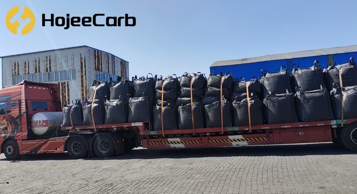 Bulk bags of activated carbon loaded for export shipment, illustrating the customs, duty and origin documentation that applies to EU imports