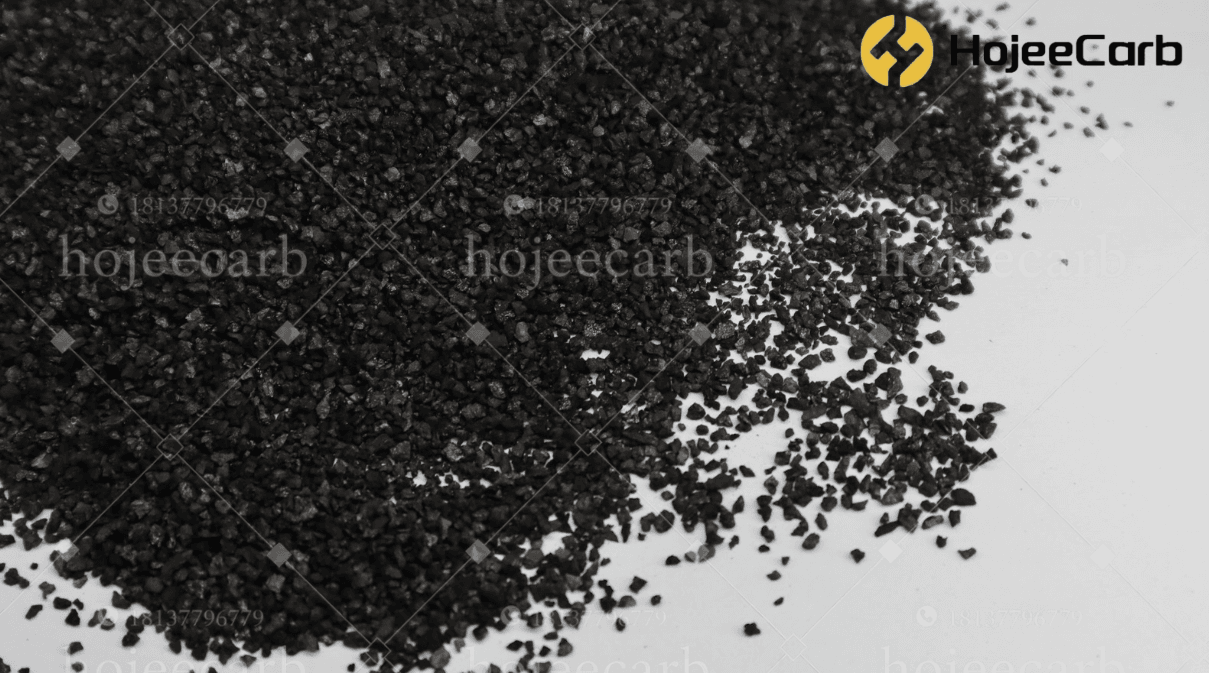 Black coal-based granular activated carbon scattered on a white background — HojeeCarb water treatment filter grade with coal gas and coal tar extracted before carbonisation for low bulk density and no colour bleed
