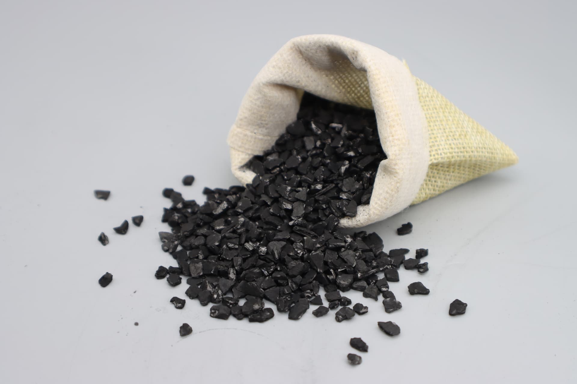 Coconut shell activated carbon 4x8 mesh granules showing particle size uniformity and black color