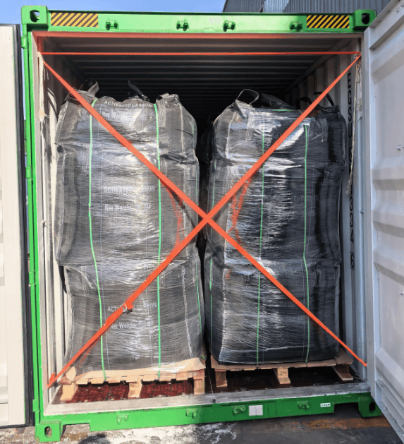 700kg jumbo bags of pellet activated carbon secured with cross-straps inside shipping container