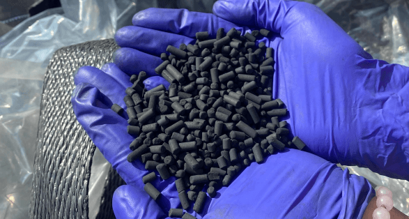 4mm KOH-impregnated coal-based pellet activated carbon close-up — biogas desulfurization grade