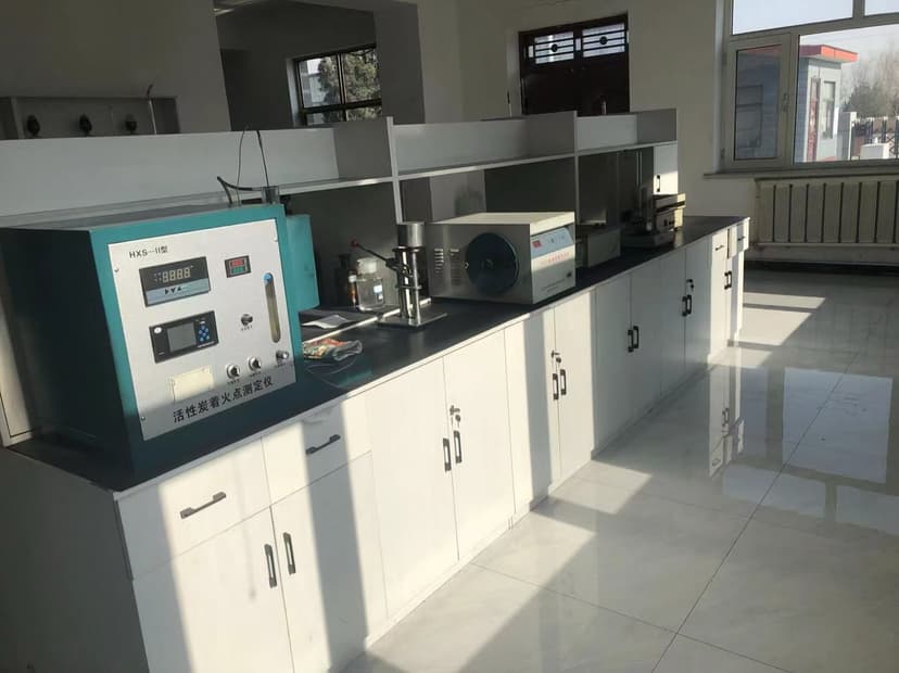 In-house laboratory with activated carbon ignition-point tester and analysis instruments