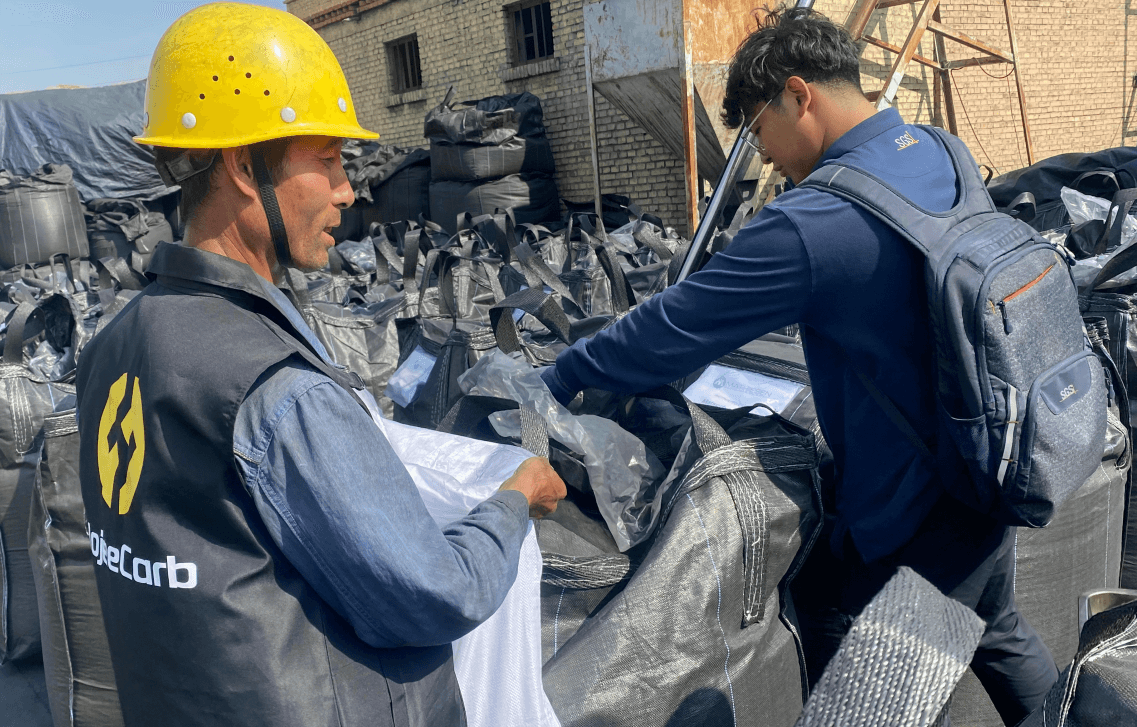 Quality control inspector checking activated carbon product specifications
