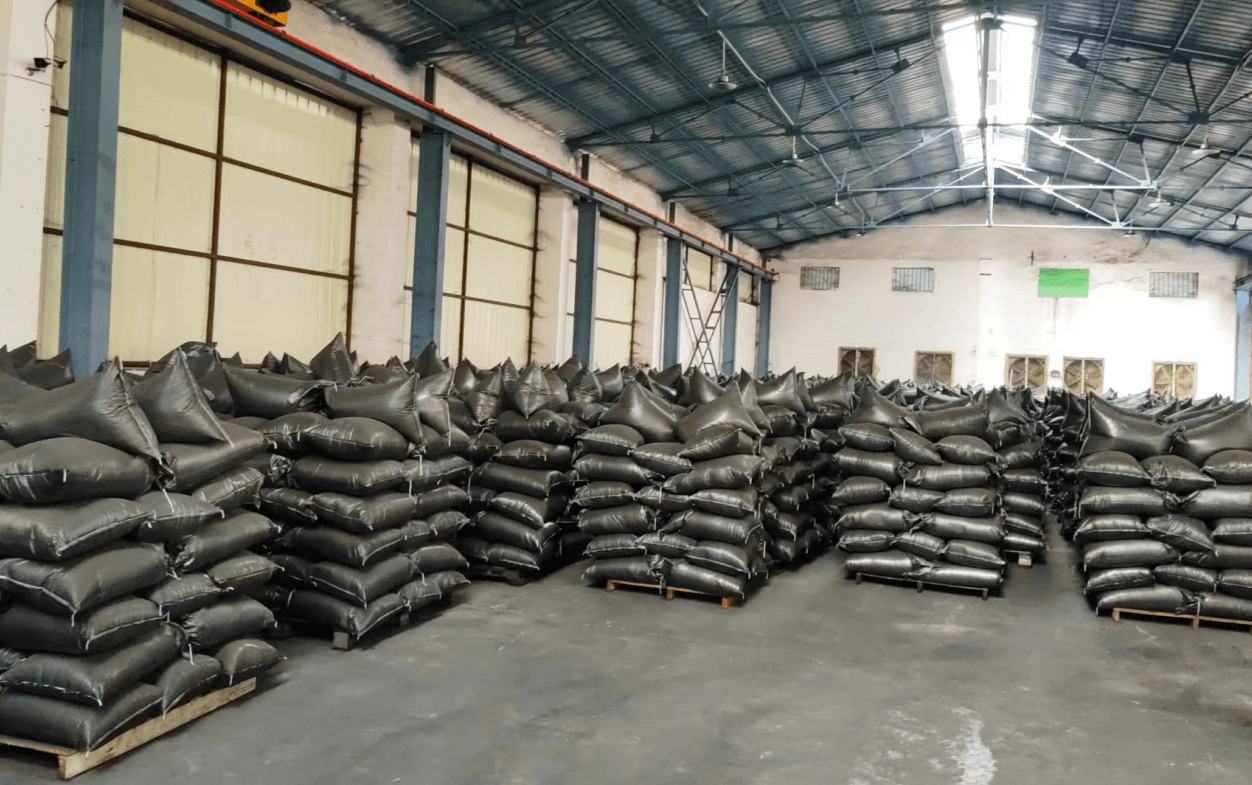 Warehouse storing activated carbon in black bags ready for bulk shipment