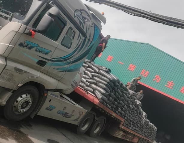Bulk activated carbon jumbo bags loaded onto a truck at the factory yard for export