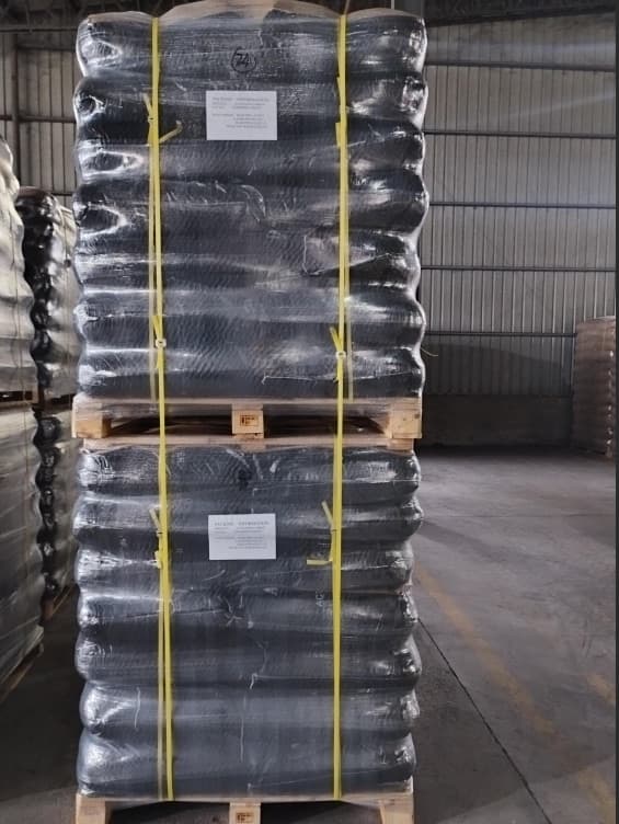 Coconut shell activated carbon in woven bags, shrink-wrapped and palletized for export