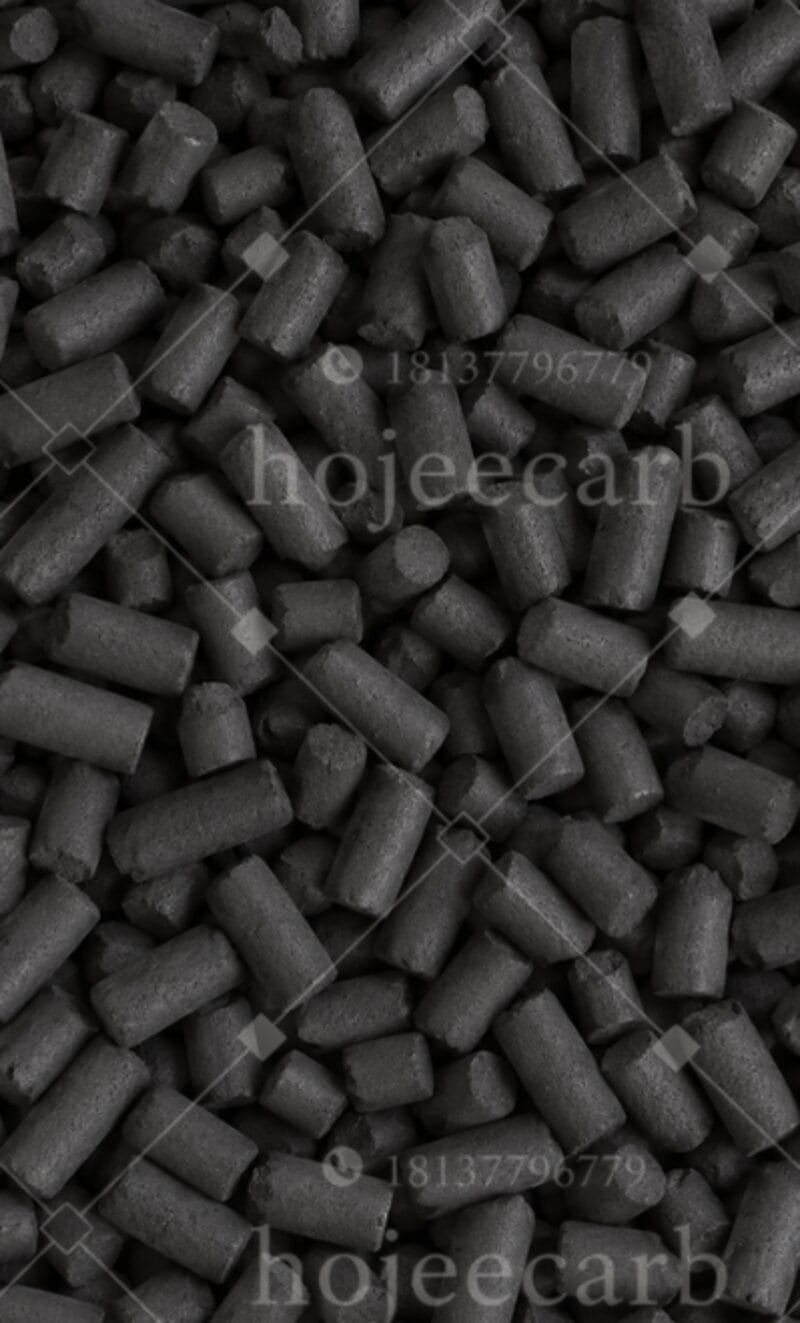 Close-up of black columnar CuO/MgO-impregnated activated carbon pellets showing uniform 3-4mm cylindrical granules