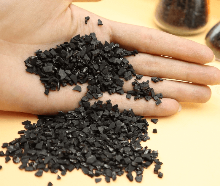 Gold recovery activated carbon granules in hand