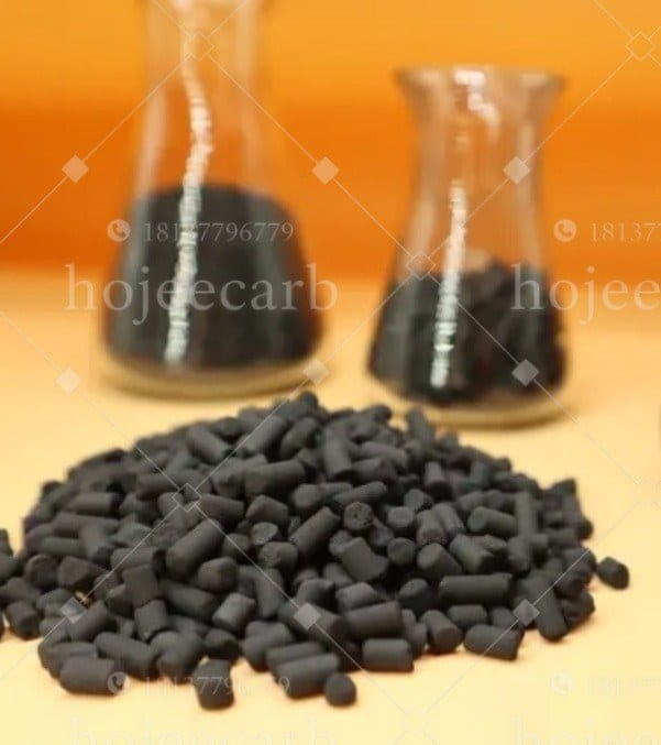 Black columnar KI-impregnated activated carbon pellets in front of iodine test flasks