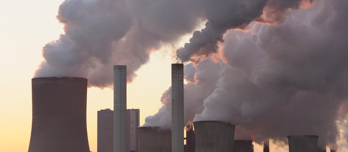 Industrial stacks emitting mercury-laden flue gas treated with sulfur impregnated activated carbon