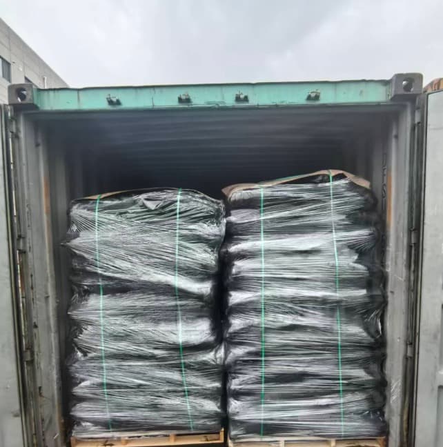Activated carbon packed and secured inside an export container